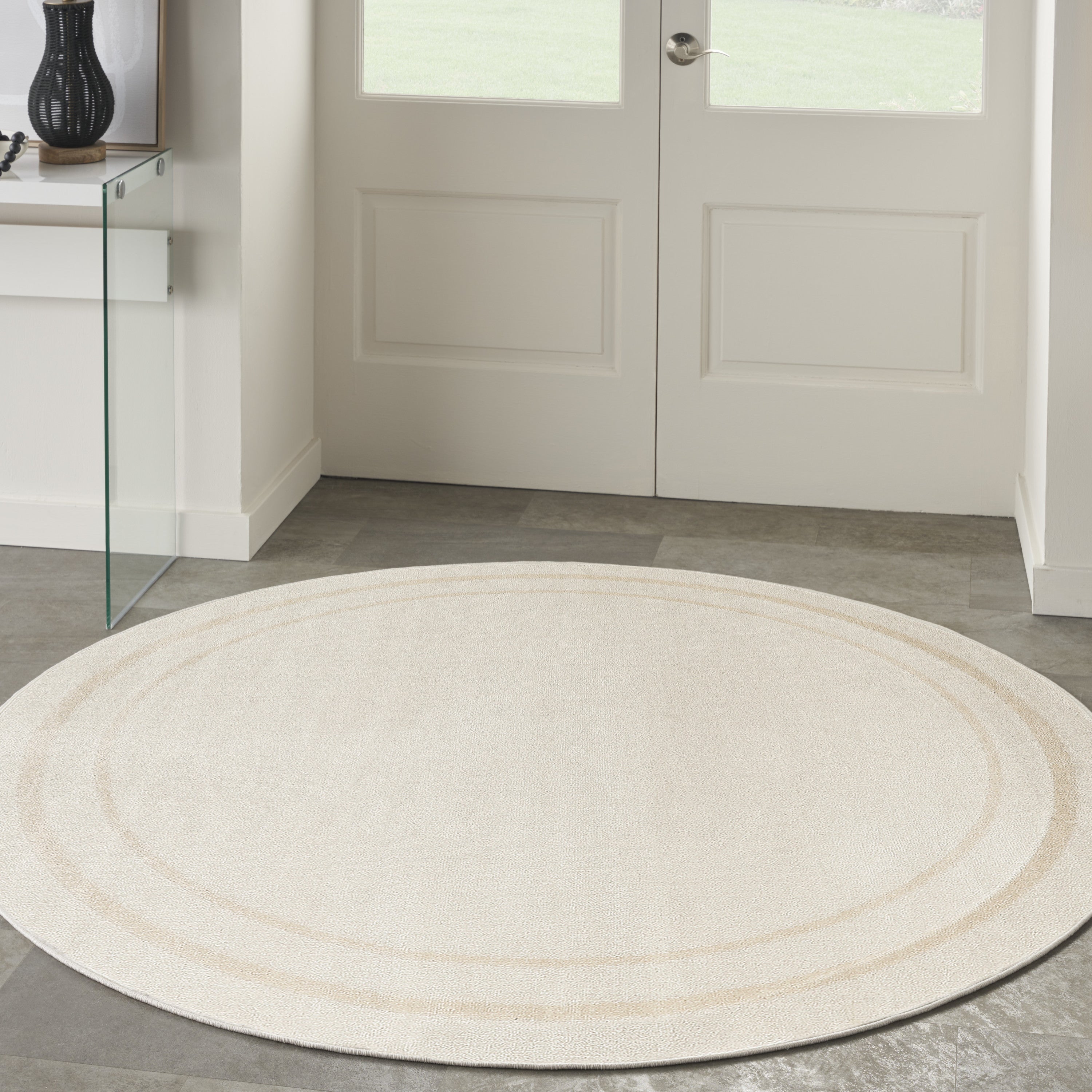 8' Ivory And Gold Round Indoor Outdoor Area Rug
