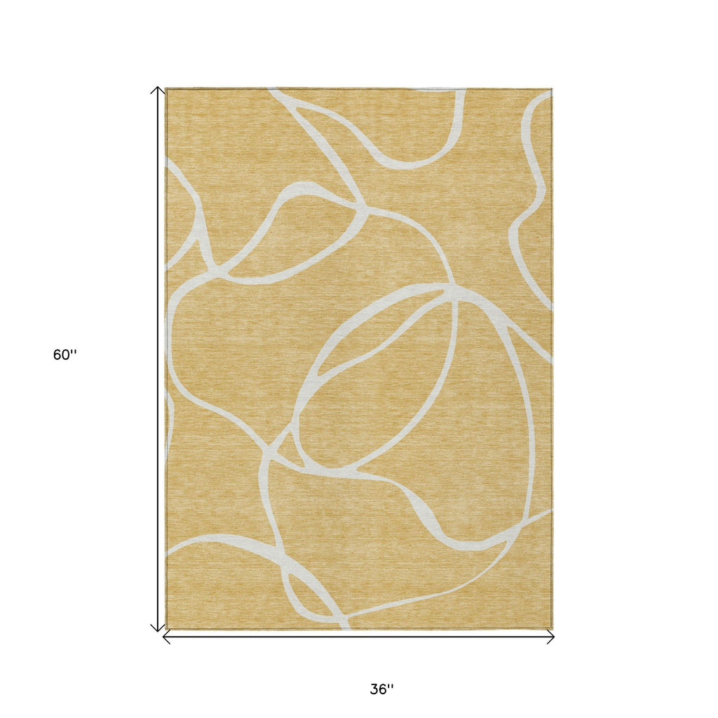 3' X 5' Gold And Ivory Abstract Washable Indoor Outdoor Area Rug